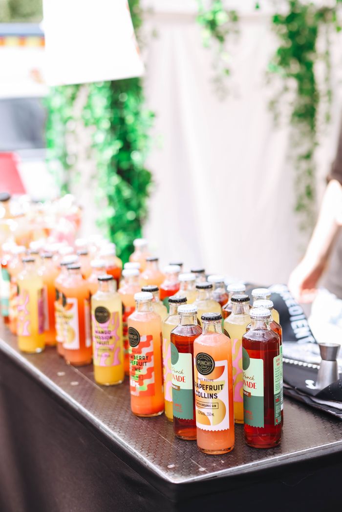 Vibrant assortment of bottled juices on a table, perfect for a refreshing summer drink.